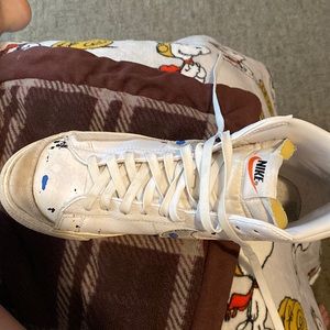 They are white with fake paint splatters